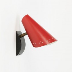 Red wall lamp with perforated edge