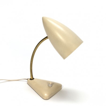 Table lamp with cream colored cap