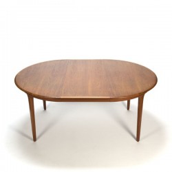 Extendable round teak dining table