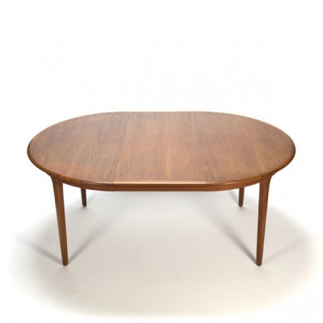 Extendable round teak dining table
