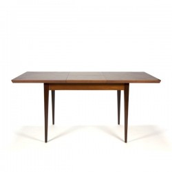 Teak dining table with extra leaf between
