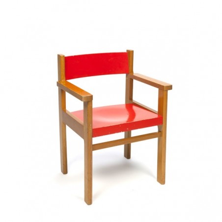 Wooden children's chair with red seat