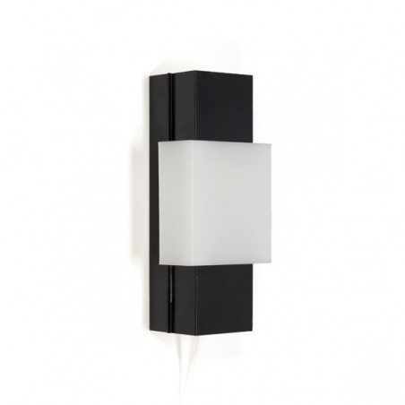 Black metal wall lamp with white plastic