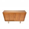 Small teak cabinet with sliding doors