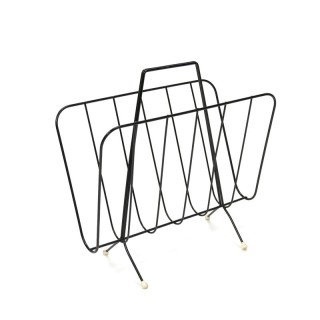 Black metal newspaper rack from the sixties