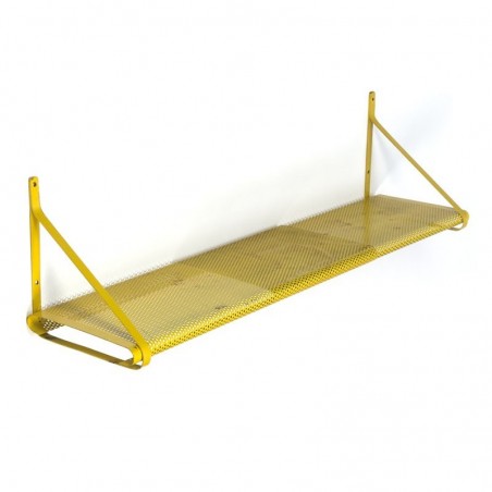 Vintage perforated metal shelf in yellow
