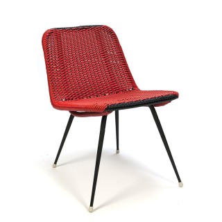 Red vintage chair made of braided plastic wire
