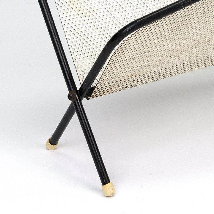 Symmetrical vintage perforated metal magazine rack