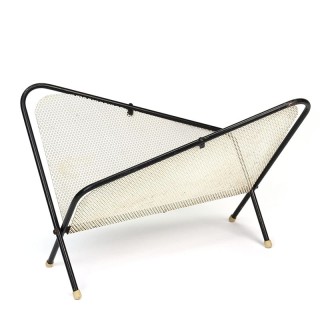 Symmetrical vintage perforated metal magazine rack