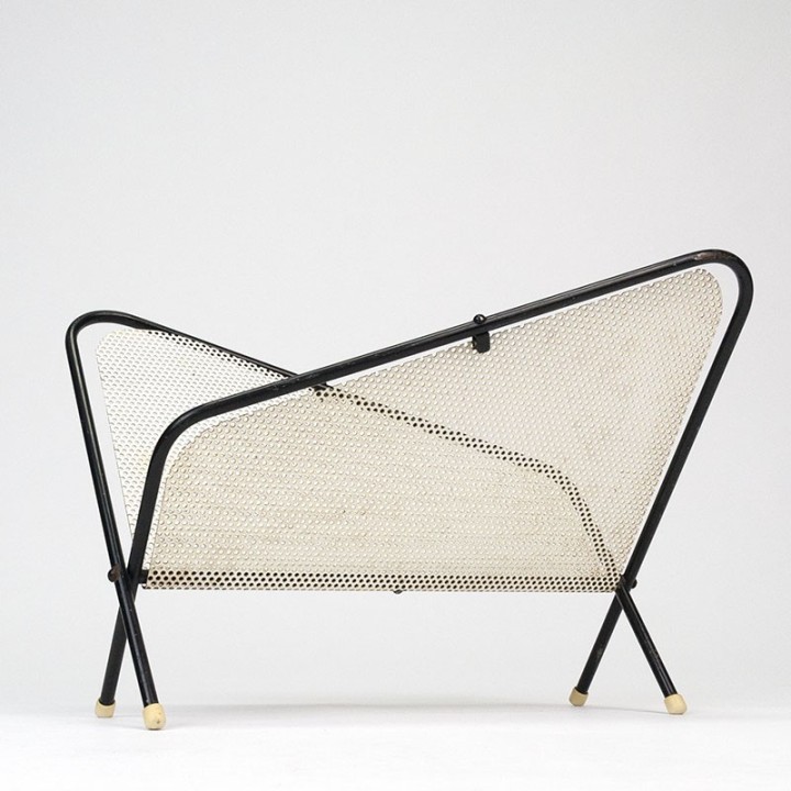 Symmetrical vintage perforated metal magazine rack
