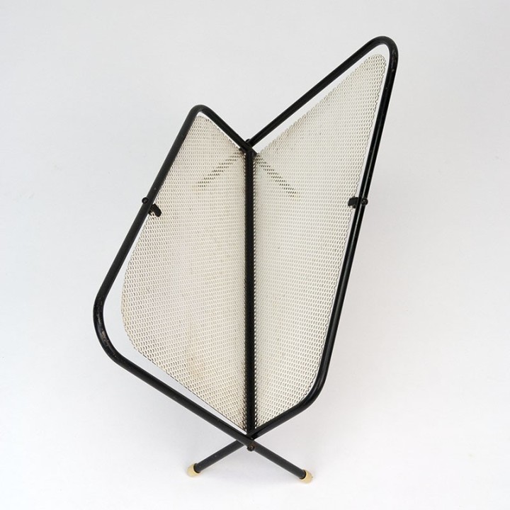 Symmetrical vintage perforated metal magazine rack