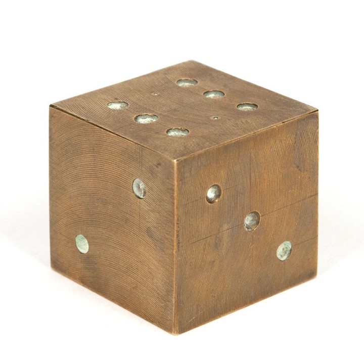 Vintage brass object as dice