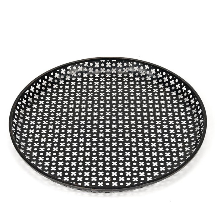 Perforated metal vintage bowl in the style of Mathieu Mategot