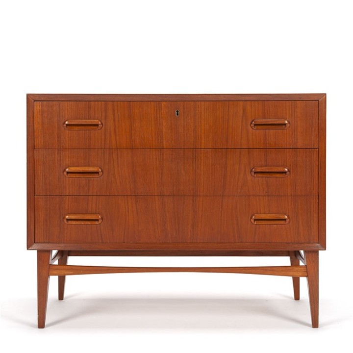 Danish vintage teak chest of drawers on a slender base
