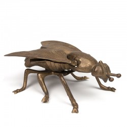 Brass vintage object as a fly