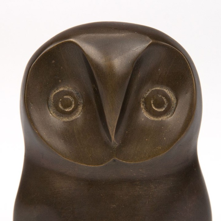 Abstractly designed vintage sculpture of an owl