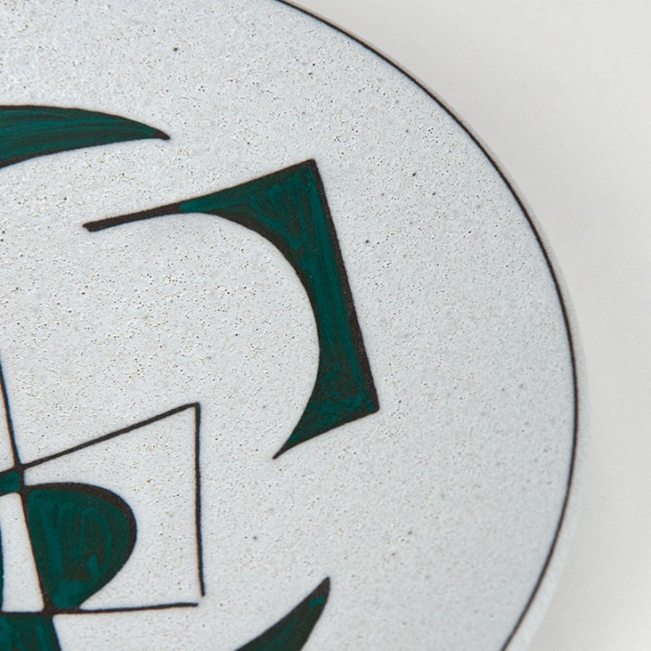 Ceramic vintage plate with abstract image